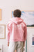 Man with a pink sweater with art wall