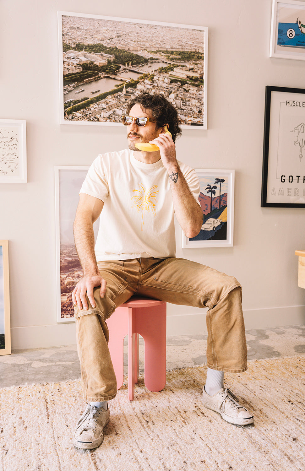 Man wearing a cream t shirt with a banana and sunglasses in san luis obispo