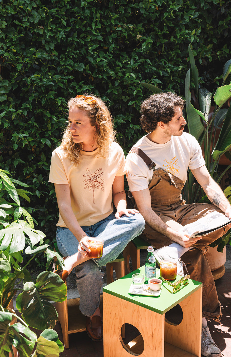 Man and woman in a garden drinking coffee with a coffee and fresh drinks in san luis obispo