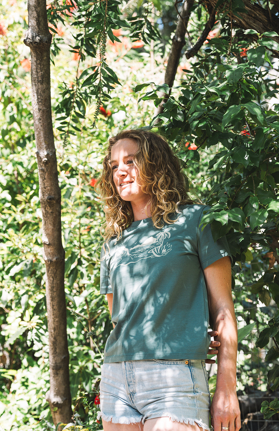 woman wearing a green lava java t shirt in san luis obispo