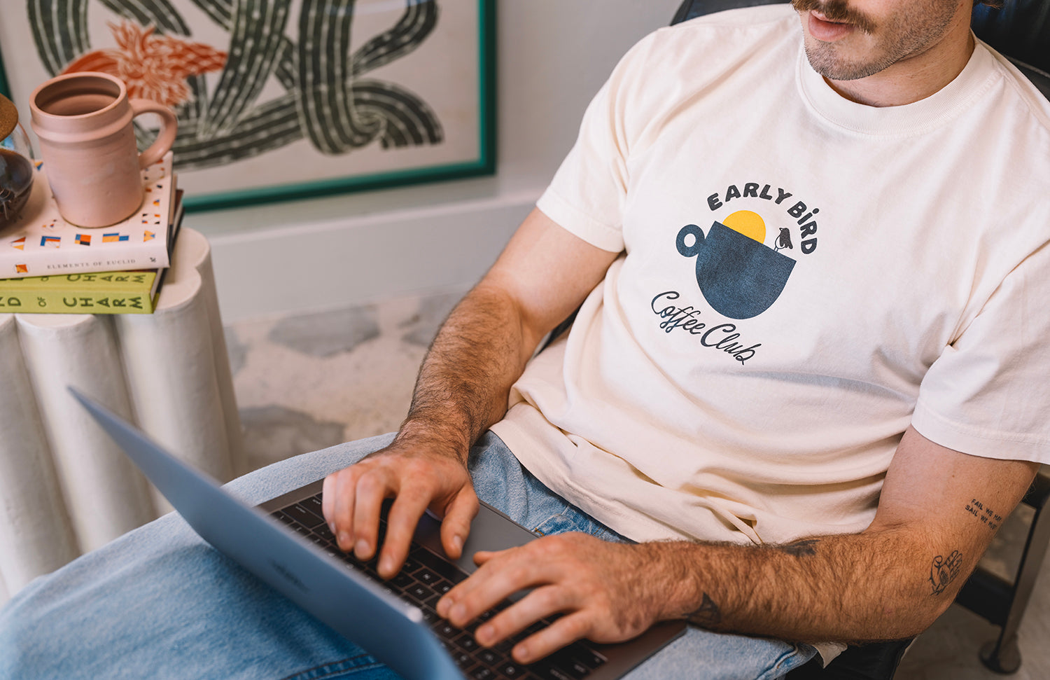 cream t shirt male with early bird design