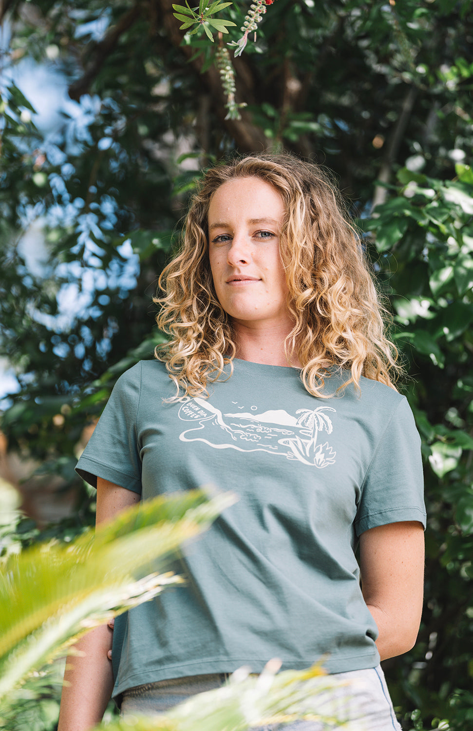 Woman wearing a green shirt lava java island in nature