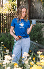 Woman gardening with a blue early bird t shirt, drinking a coffee 
Buen dia coffee