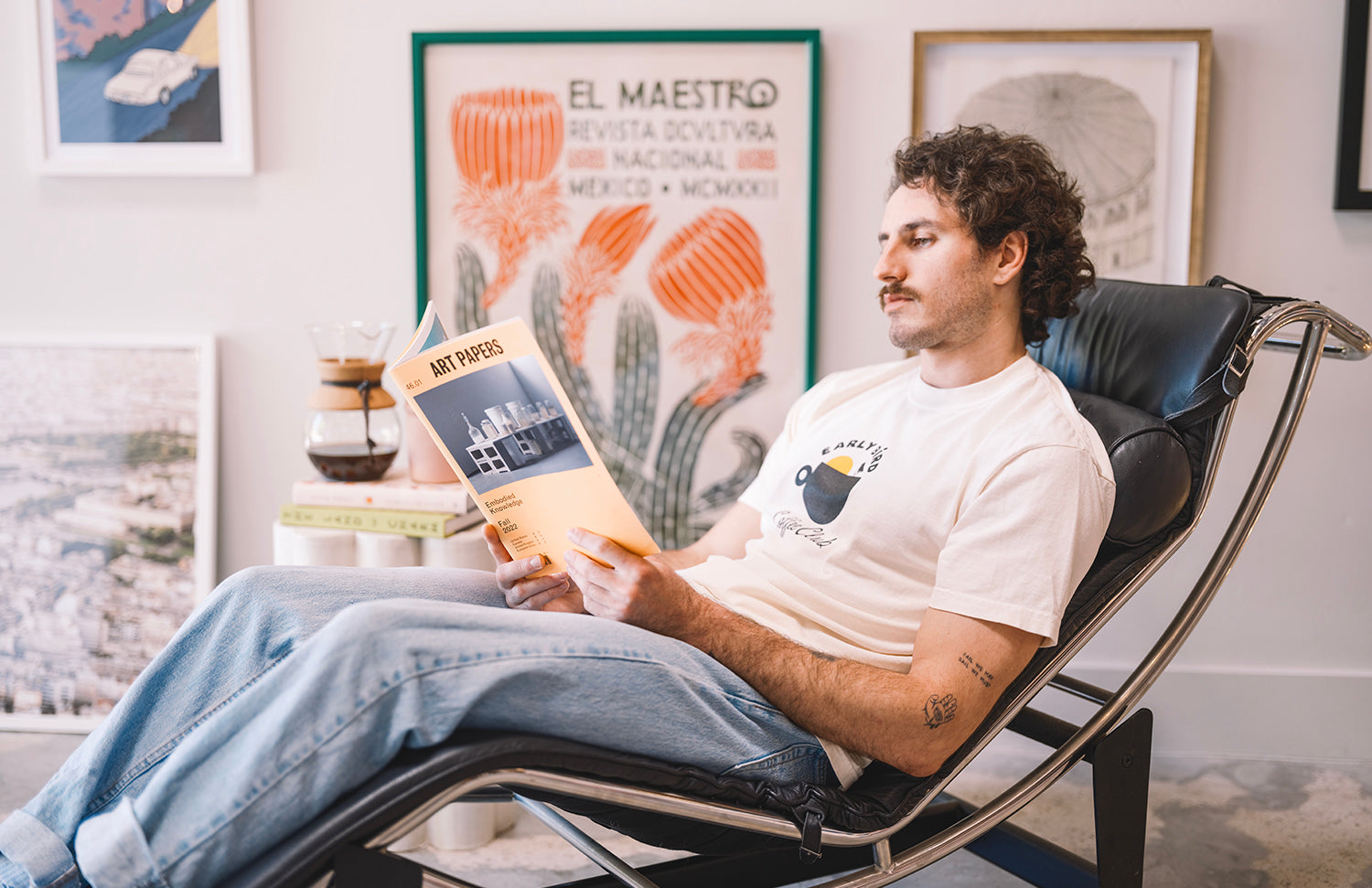 cream t shirt male with early bird design and wall art