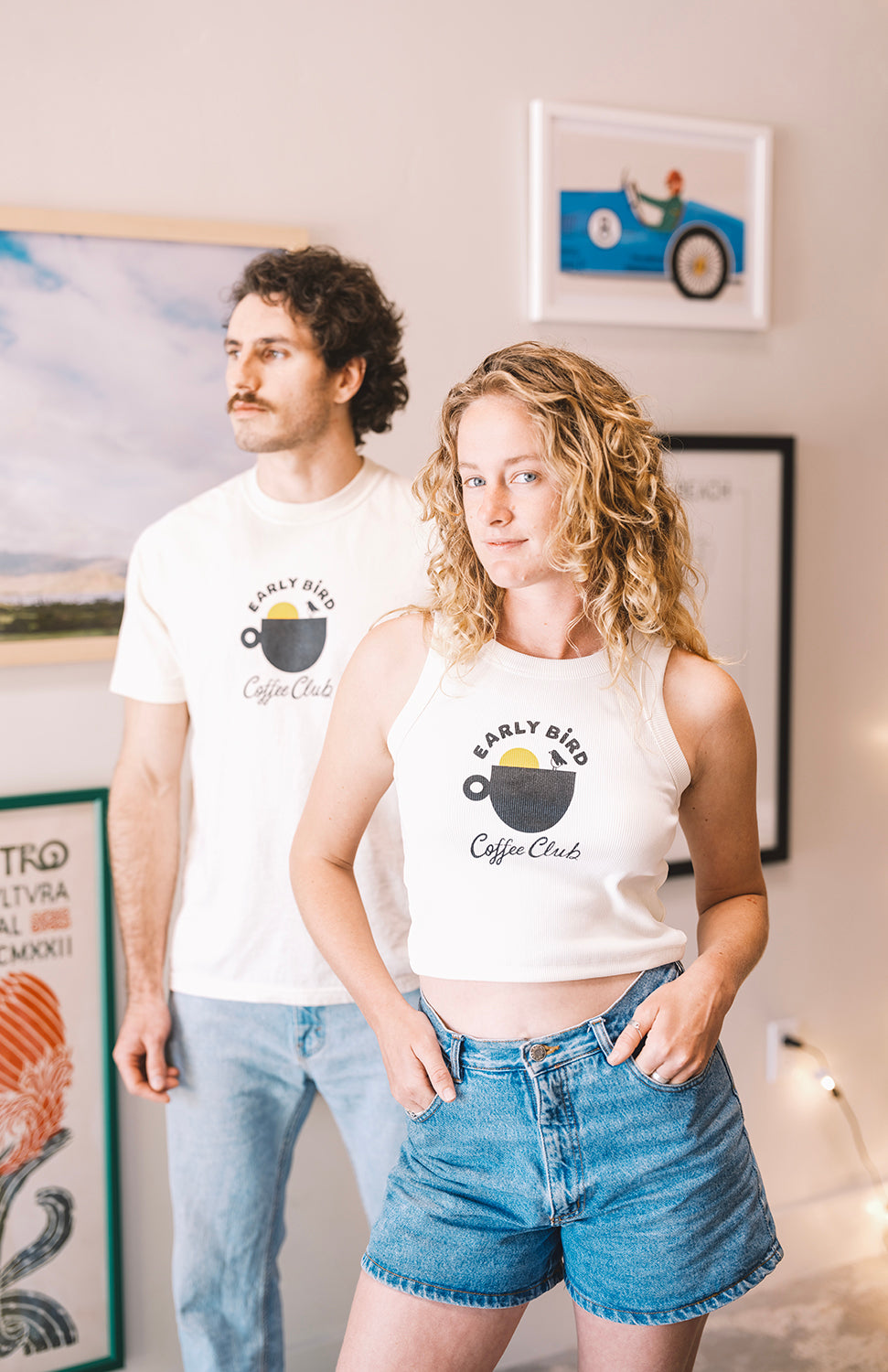Woman with a Early bird tank top cream and shorts in buen dia coffee san luis obispo