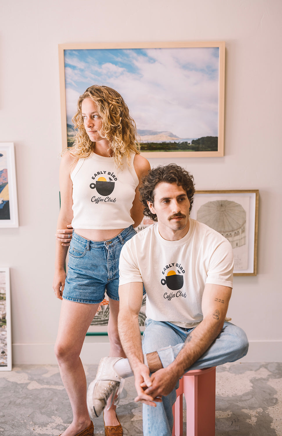 Woman with a Early bird tank top cream and mann with a early bird t shirt in buen dia coffee san luis obispo 