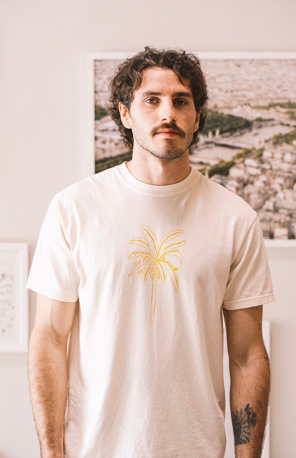 Man wearing a cream t shirt el banano in buen dia coffee