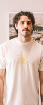 Man wearing a cream t shirt el banano in buen dia coffee