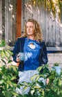Blue t shirt for women early bird coffee club with a navy blue sweater Buen dia coffee